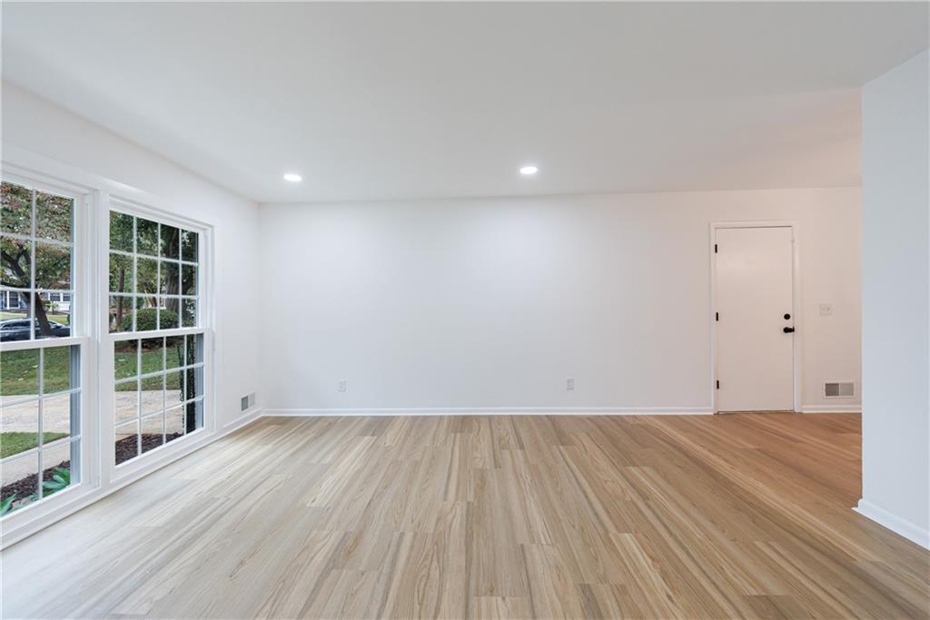 4360 Sasanqua Court Tucker, GA 30084 - Photo 15 of 37 wooden floor in an empty room with a window