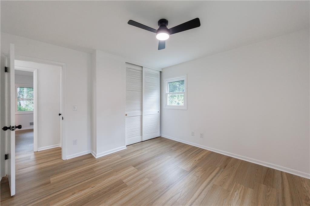 4360 Sasanqua Court Tucker, GA 30084 - Photo 20 of 37 wooden floor in an empty room with a window