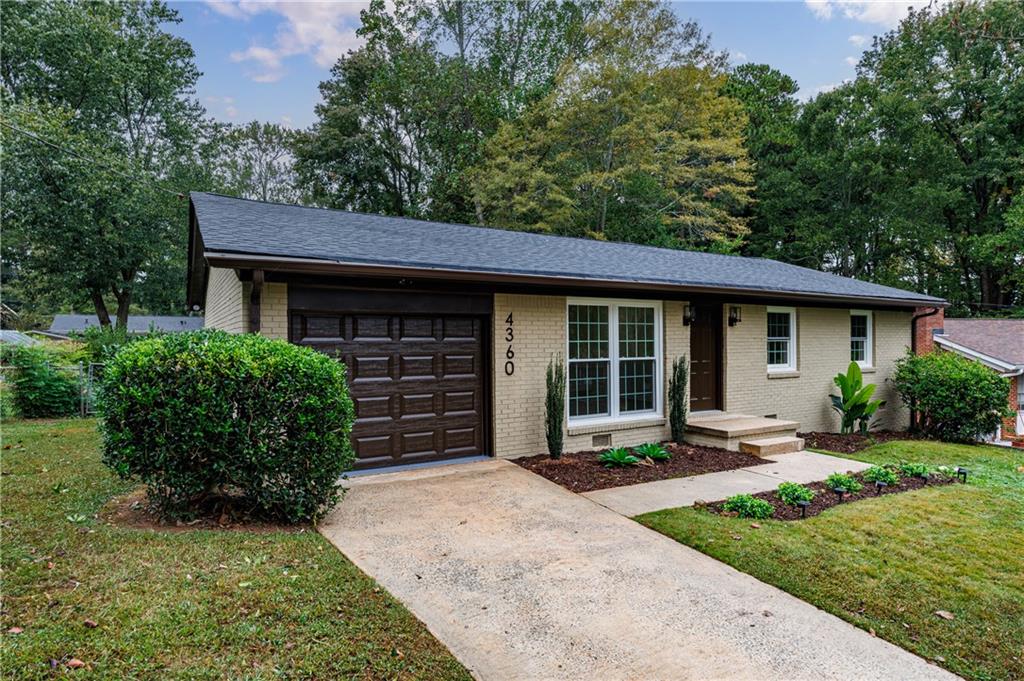 4360 Sasanqua Court Tucker, GA 30084 - Photo 2 of 37 front view of a house with a yard