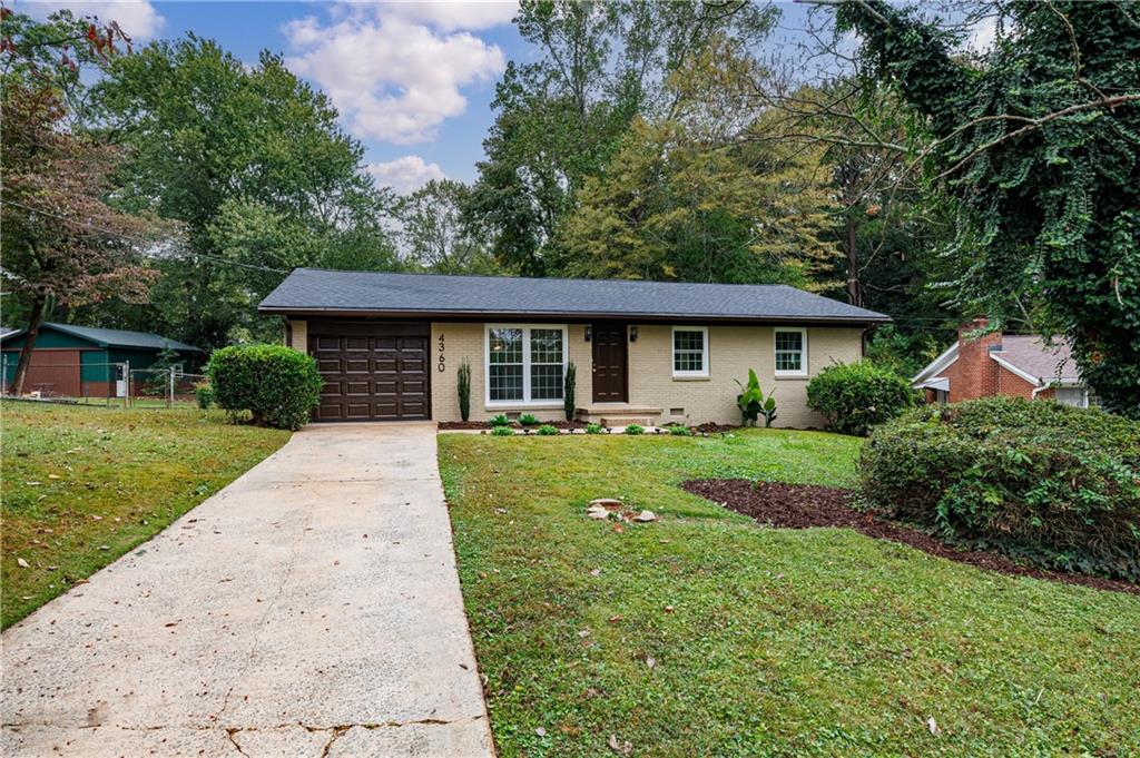 4360 Sasanqua Court Tucker, GA 30084 - Photo 3 of 37 a front view of a house with a yard