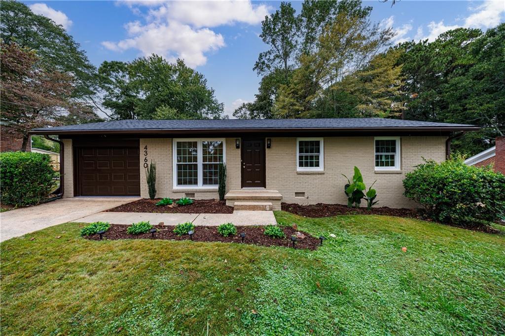 4360 Sasanqua Court Tucker, GA 30084 - Photo 4 of 37 a front view of house with yard and green space