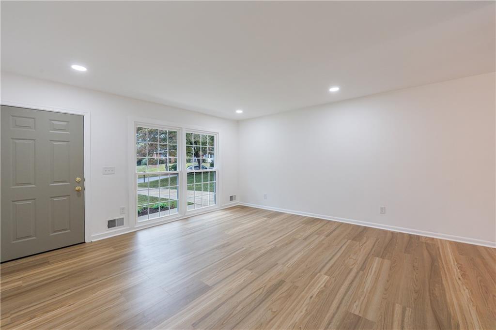 4360 Sasanqua Court Tucker, GA 30084 - Photo 7 of 37 wooden floor in an empty room with a window