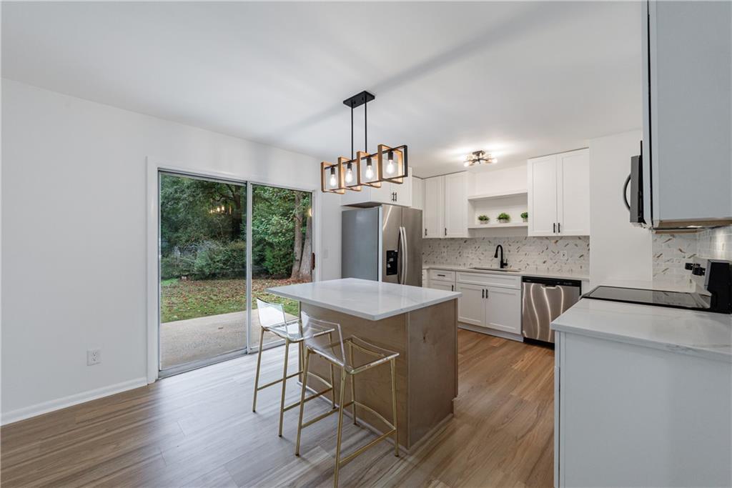 4360 Sasanqua Court Tucker, GA 30084 - Photo 9 of 37 a kitchen that has a lot of cabinets in it