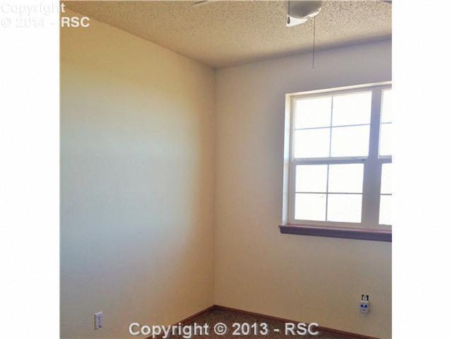 7950 Mulberry Road Calhan, CO 80808 - Photo 17 of 25 Note the size of the secondary bedrooms. Both have large vinyl window and ceiling fan.