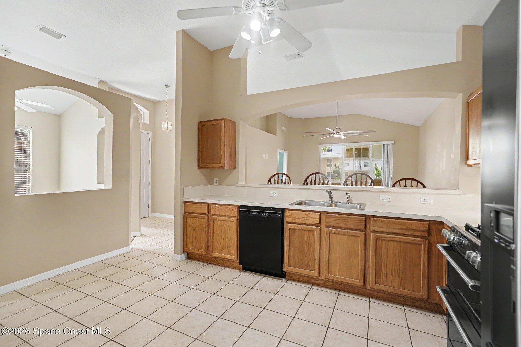 284 Intrepid Way Indialantic, FL 32903 - Photo 16 of 36 a spacious bathroom with a granite countertop sink mirror and
