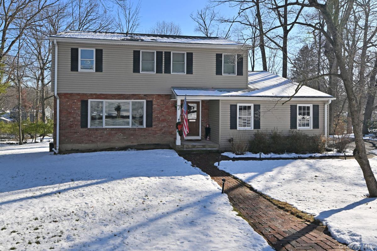 View of front of house featuring brick siding