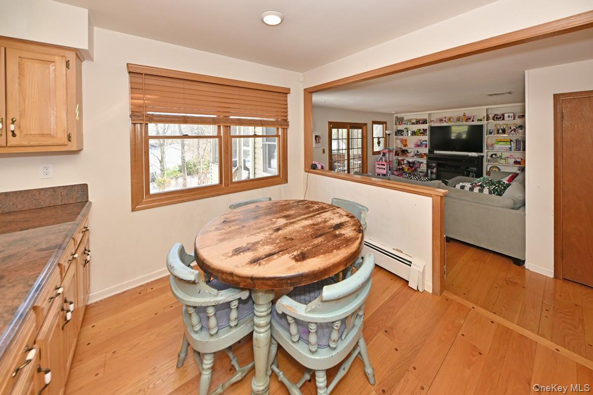7 Lexington Road New City, NY 10956 - Photo 13 of 36 Dining space featuring light wood finished floors, plenty of natural light, and baseboard heating