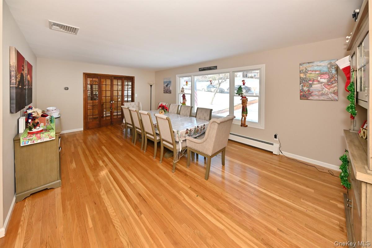 7 Lexington Road New City, NY 10956 - Photo 14 of 36 Dining room with a baseboard heating unit and light wood-style flooring