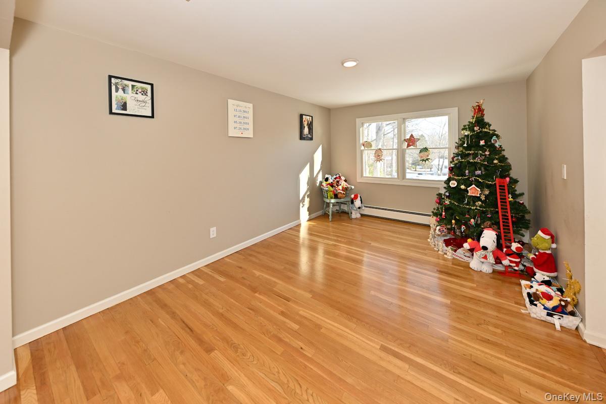 7 Lexington Road New City, NY 10956 - Photo 22 of 36 Recreation room with light wood-style floors and a baseboard radiator