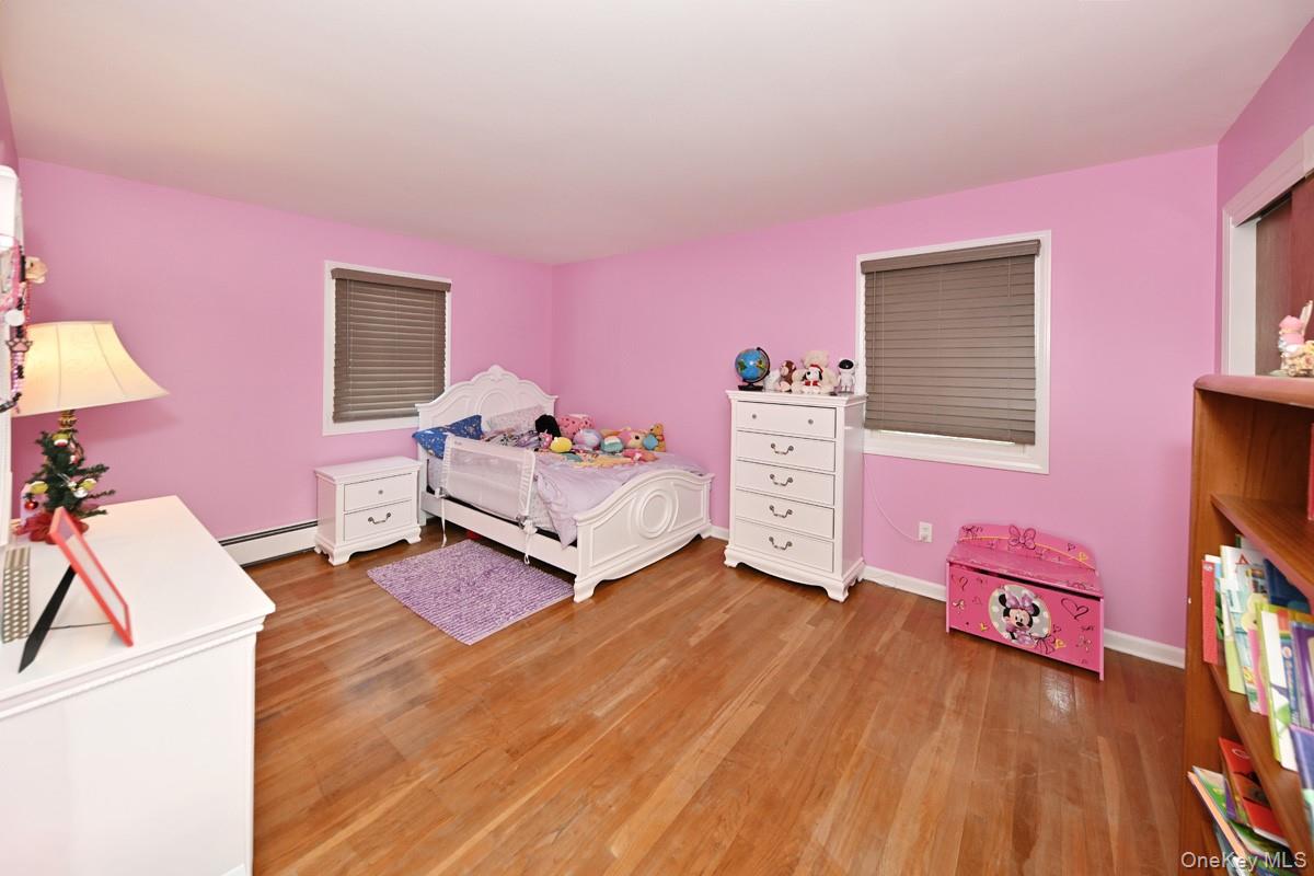 7 Lexington Road New City, NY 10956 - Photo 29 of 36 Bedroom featuring light wood-style floors and a baseboard heating unit
