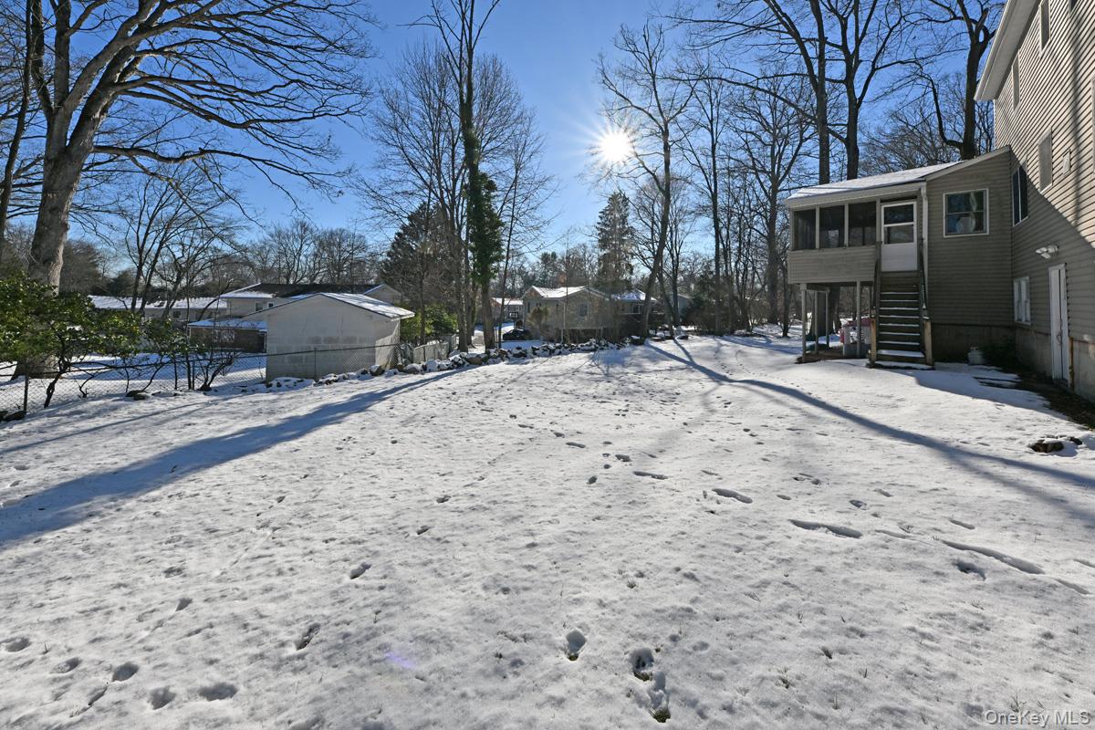 7 Lexington Road New City, NY 10956 - Photo 9 of 36 Snowy yard featuring a sunroom and stairs