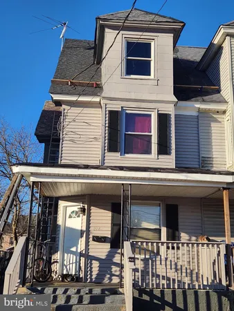 a view of a house with entrance gate
