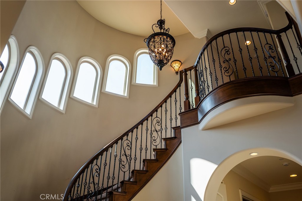 670 Pinnacle Ridge Road Riverside, CA 92506 - Photo 19 of 75 a view of staircase with railing and a chandelier