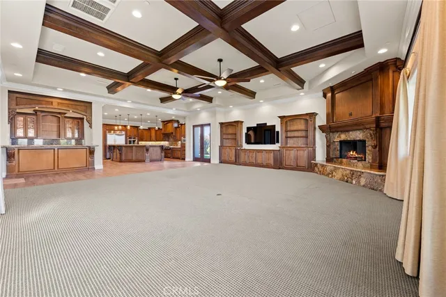 a kitchen with granite countertop a sink a counter top space stainless steel appliances and cabinets