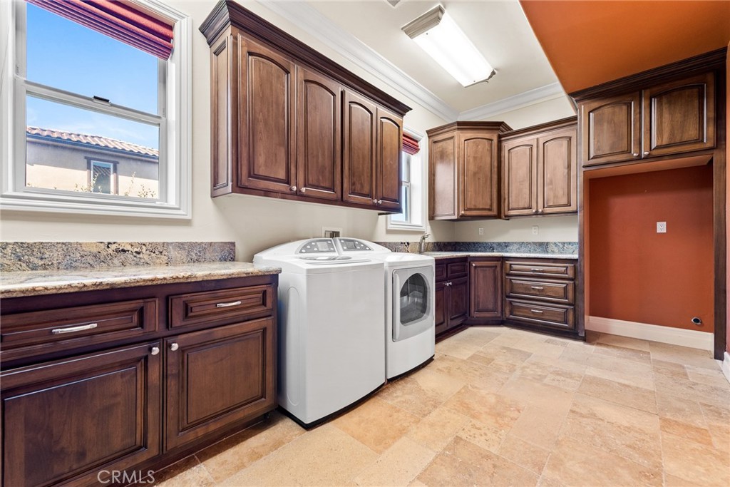 670 Pinnacle Ridge Road Riverside, CA 92506 - Photo 30 of 75 a kitchen with stainless steel appliances granite countertop a stove a sink dishwasher and a refrigerator
