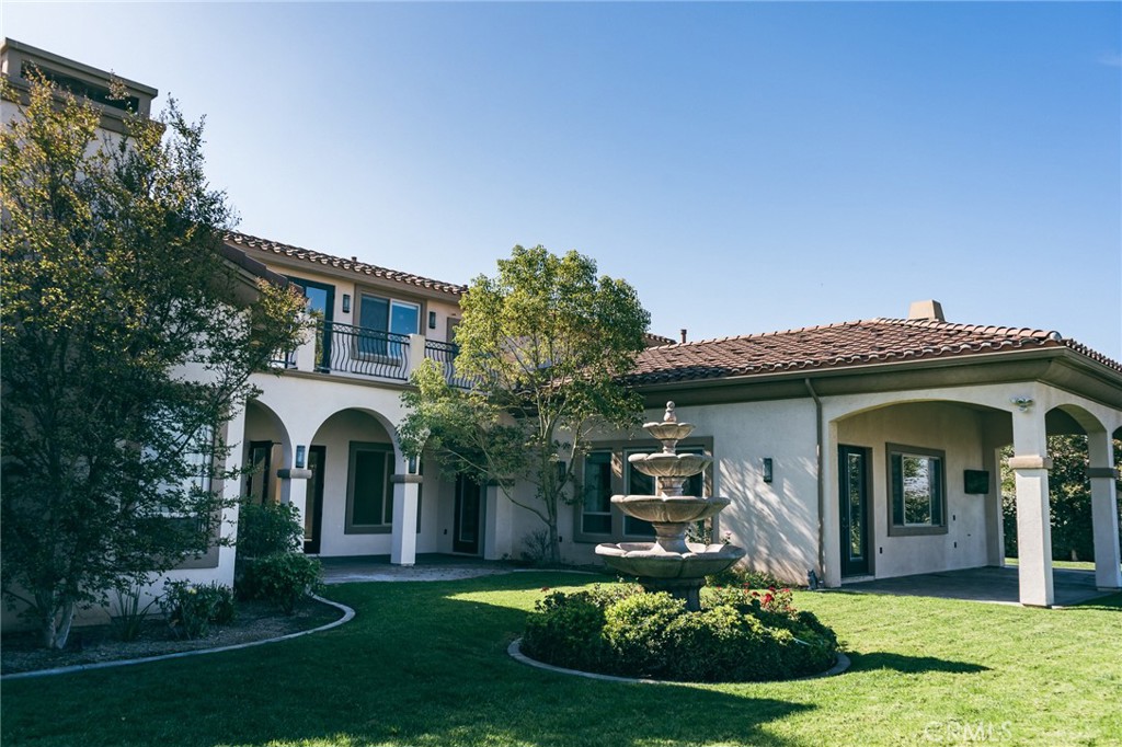 670 Pinnacle Ridge Road Riverside, CA 92506 - Photo 3 of 75 a front view of a house with a yard