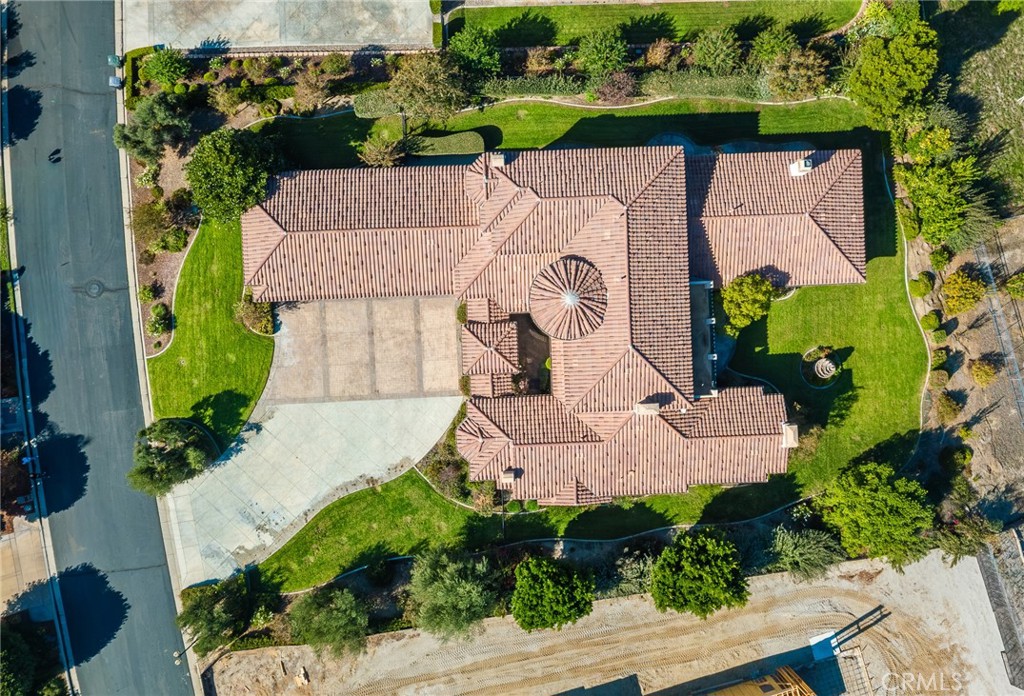670 Pinnacle Ridge Road Riverside, CA 92506 - Photo 4 of 72 an aerial view of a house with a garden and a yard