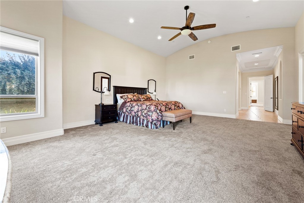 670 Pinnacle Ridge Road Riverside, CA 92506 - Photo 44 of 75 a bed room with a bed and a chandelier