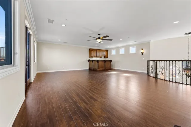 an aerial view of a house with a garden and a yard