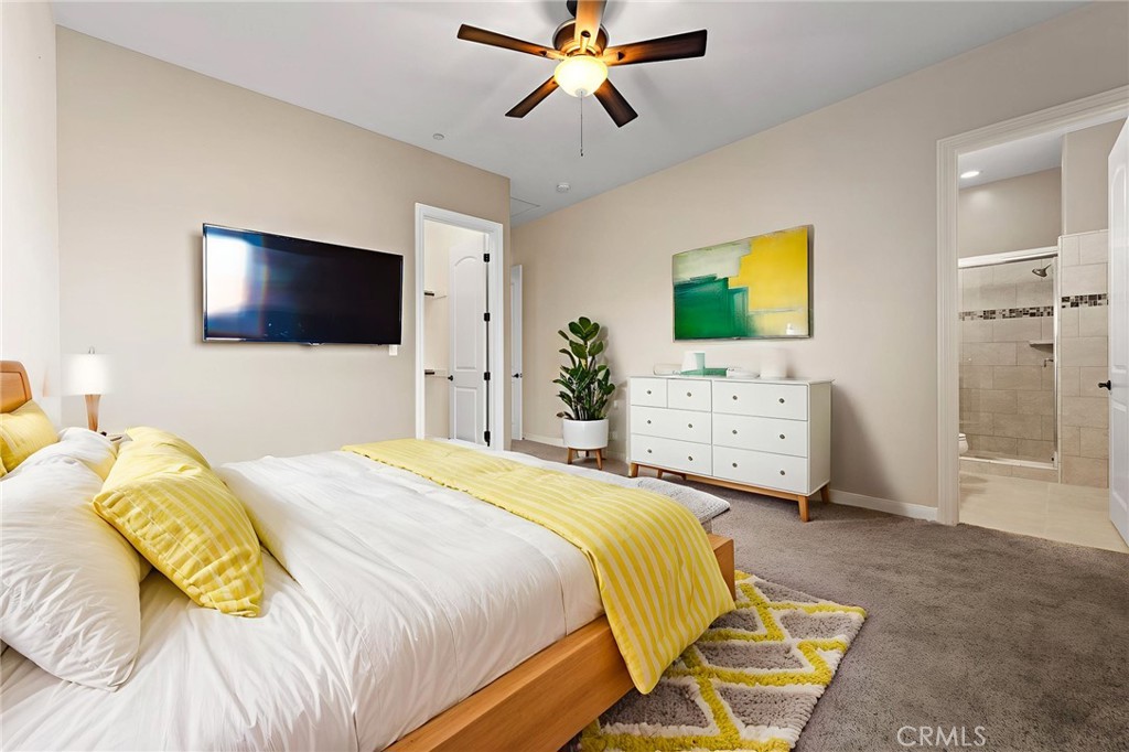 670 Pinnacle Ridge Road Riverside, CA 92506 - Photo 54 of 72 a bedroom with a bed and a flat screen tv