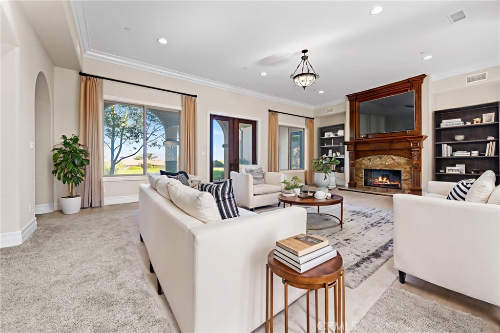 670 Pinnacle Ridge Road Riverside, CA 92506 - Photo 6 of 75 a living room with fireplace furniture and a flat screen tv