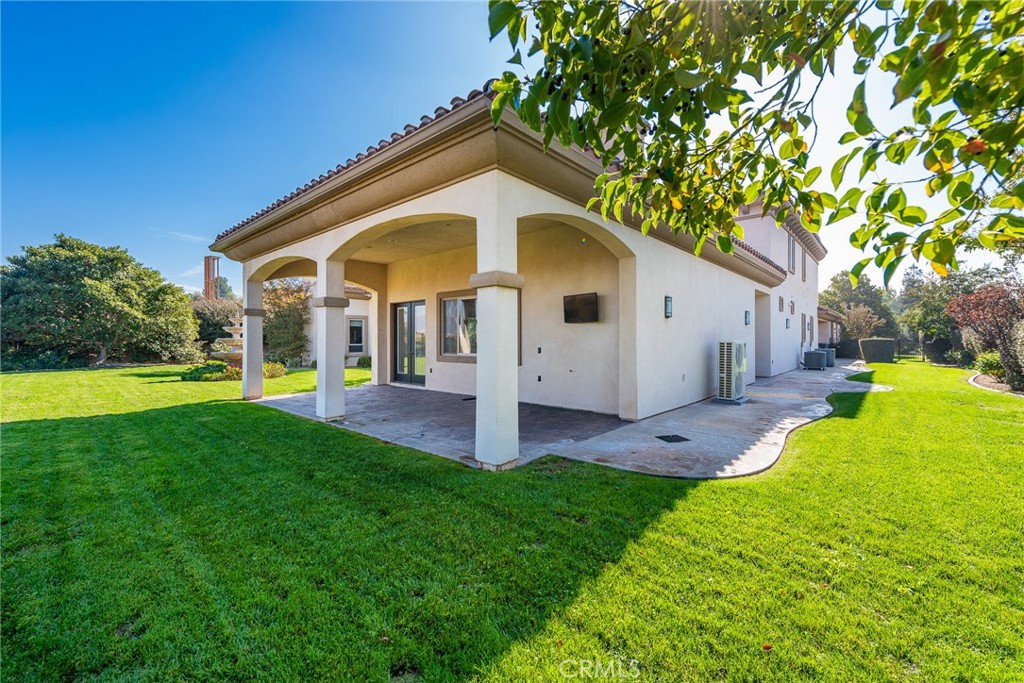 670 Pinnacle Ridge Road Riverside, CA 92506 - Photo 70 of 75 a view of a white house in front of a big yard with large trees