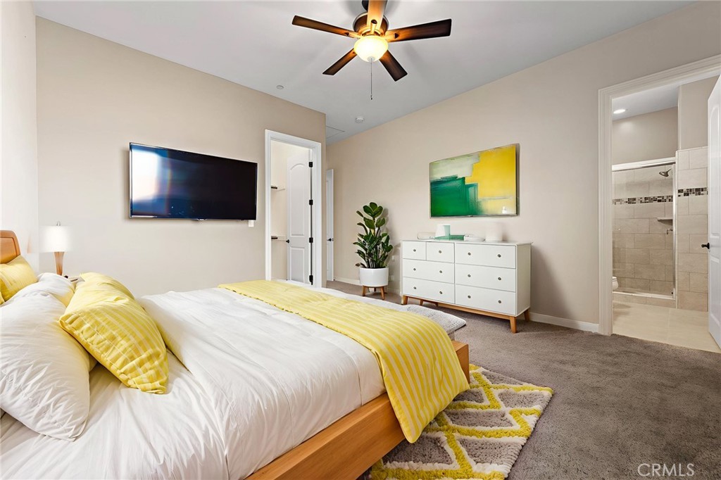 670 Pinnacle Ridge Road Riverside, CA 92506 - Photo 10 of 75 a bedroom with a bed and a flat screen tv