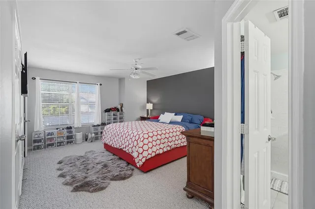 a bedroom with a bed and window