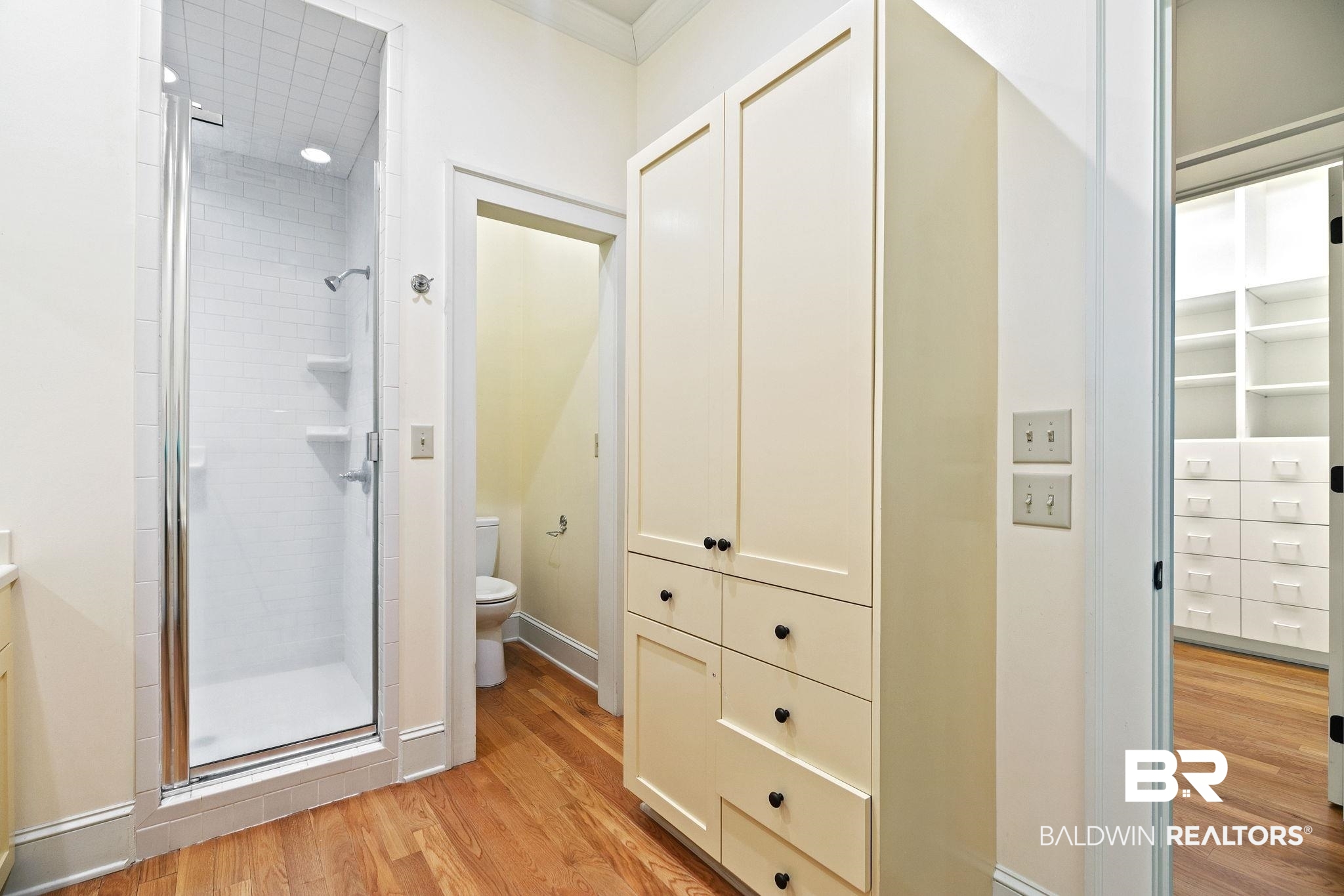 202 Beall Lane Daphne, AL 36526 - Photo 24 of 46 Bathroom featuring a shower with shower door, toilet, and hardwood / wood-style floors