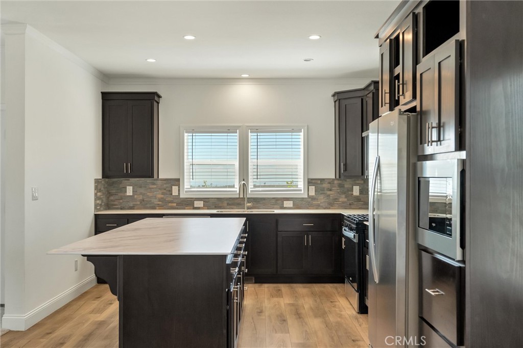 4333 Pentz Road, Unit 30 Paradise, CA 95969 - Photo 12 of 29 a kitchen with a sink and refrigerator