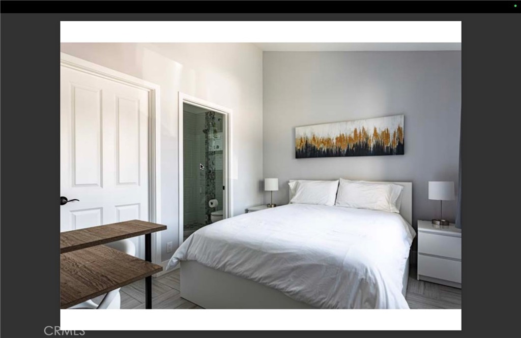 712 North Fuller Avenue West Hollywood, CA 90046 - Photo 11 of 23 a bedroom with a bed and a painting on the wall