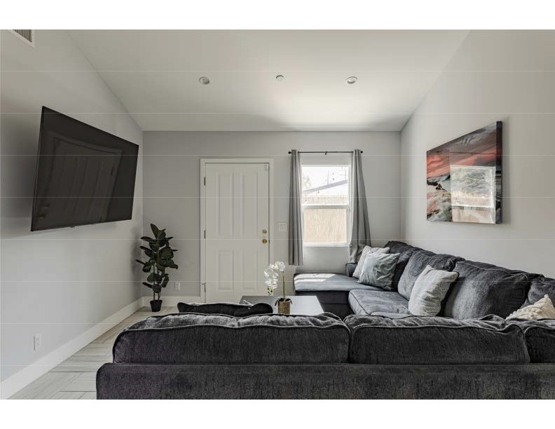 712 North Fuller Avenue West Hollywood, CA 90046 - Photo 2 of 23 a living room with furniture and a flat screen tv