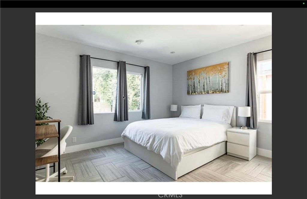 712 North Fuller Avenue West Hollywood, CA 90046 - Photo 9 of 23 a bedroom with a bed a table and chair