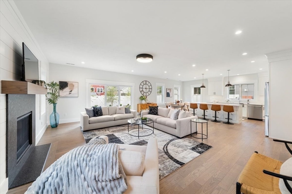 18 Walcott Street Natick, MA 01760 - Photo 15 of 36 a living room with furniture and a fireplace