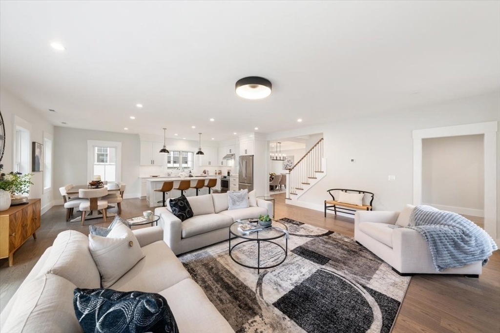 18 Walcott Street Natick, MA 01760 - Photo 16 of 36 a living room with furniture and a wooden floor