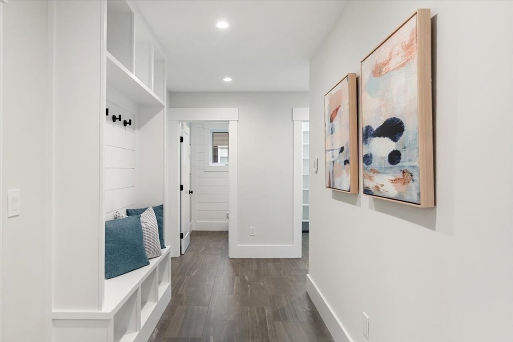 18 Walcott Street Natick, MA 01760 - Photo 23 of 36 a view of a hallway with wooden floor and closet