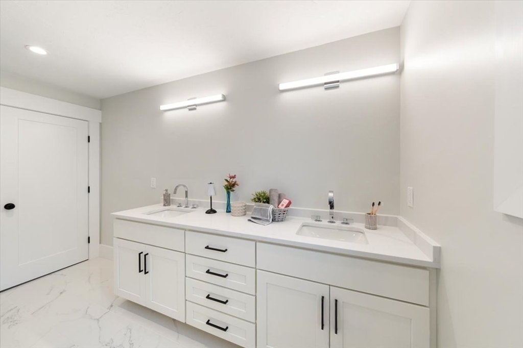 18 Walcott Street Natick, MA 01760 - Photo 26 of 36 a bathroom with a sink and a mirror