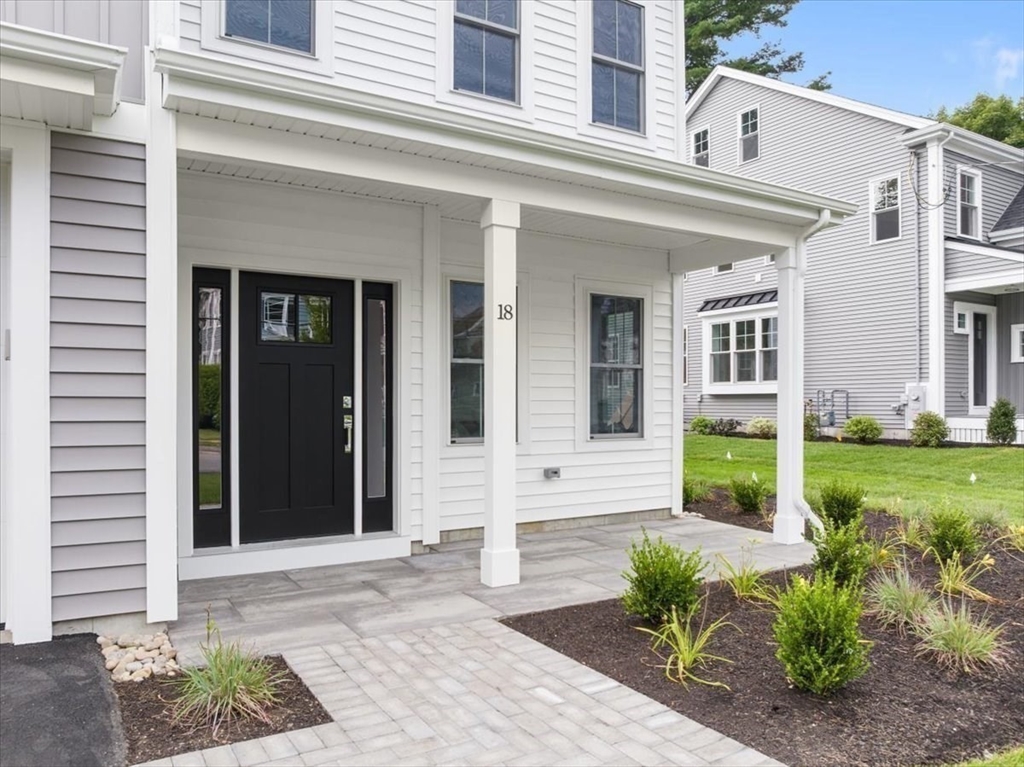 18 Walcott Street Natick, MA 01760 - Photo 3 of 36 a front view of a house with garden