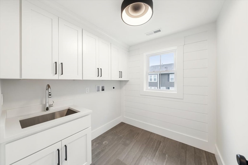 18 Walcott Street Natick, MA 01760 - Photo 33 of 36 a view of cabinets and sink