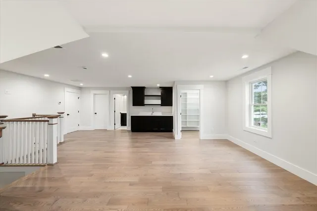 a view of kitchen and hall with wooden floor