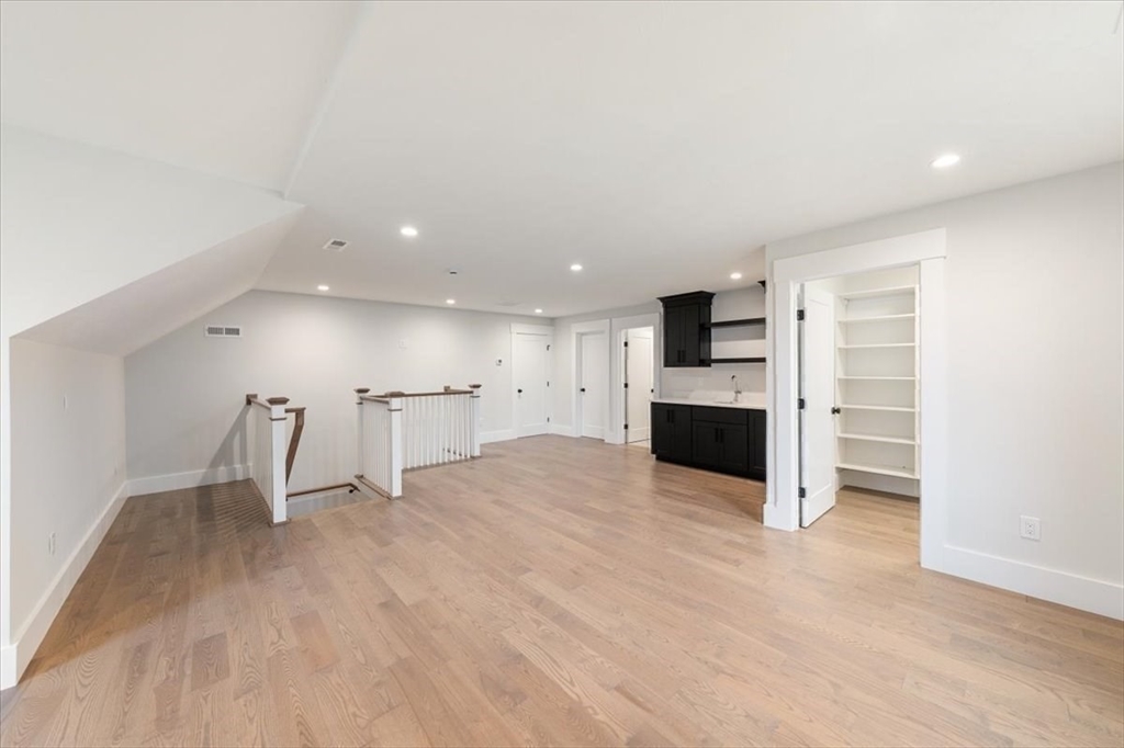 18 Walcott Street Natick, MA 01760 - Photo 35 of 36 a view of a kitchen with a sink and a refrigerator