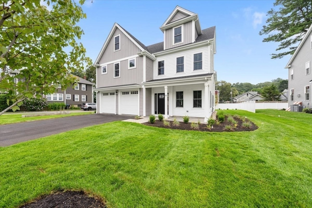18 Walcott Street Natick, MA 01760 - Photo 4 of 36 a front view of a house with a yard
