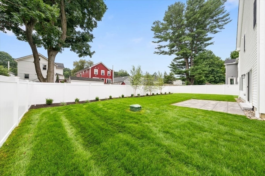 18 Walcott Street Natick, MA 01760 - Photo 5 of 36 a view of yard with grass and trees