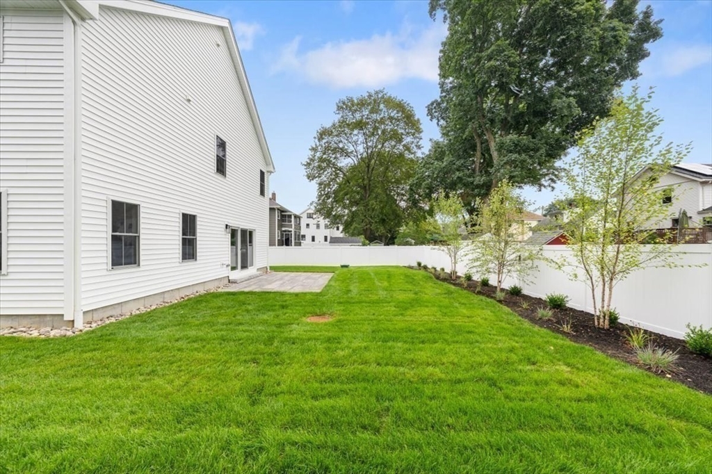 18 Walcott Street Natick, MA 01760 - Photo 7 of 36 a view of backyard with swimming pool