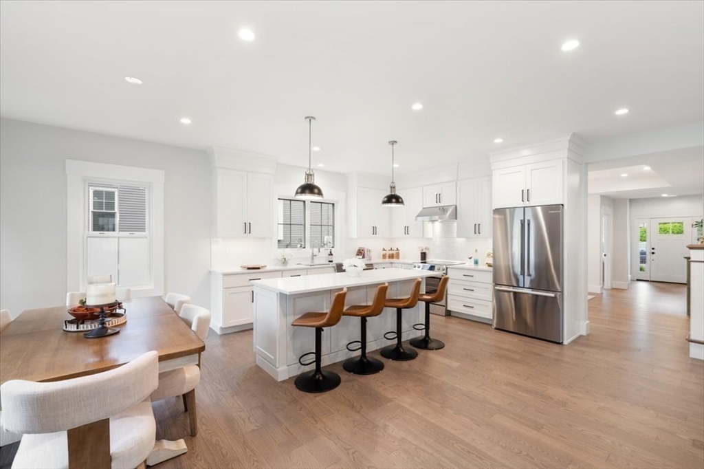 18 Walcott Street Natick, MA 01760 - Photo 10 of 36 a large kitchen with a table and chairs