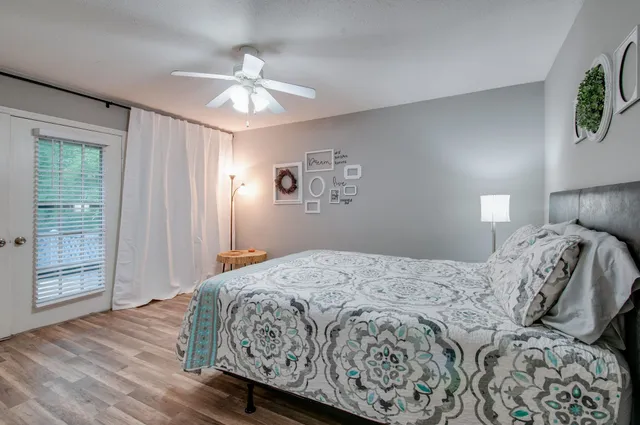 a living room with furniture a window a fireplace and a flat tv screen