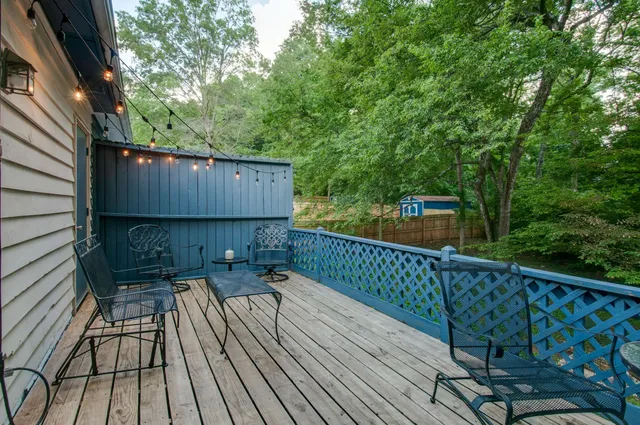 a view of deck with wooden floor and outdoor seating