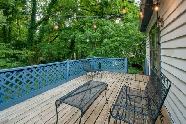a backyard of a house with a yard and outdoor seating