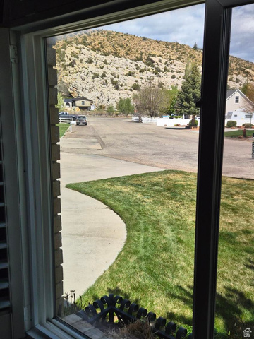1697 West 2450 Vernal, UT 84078 - Photo 7 of 36 View of grassy yard with a mountain view