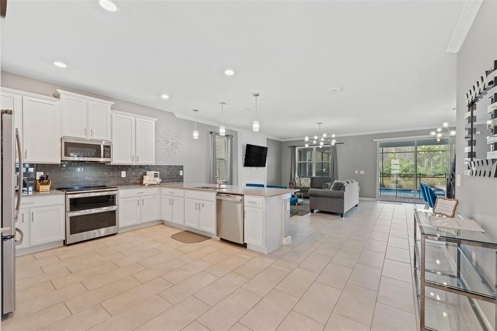 3000 Penelope Loop Kissimmee, FL 34746 - Photo 15 of 53 a kitchen with sink cabinets and counter top space